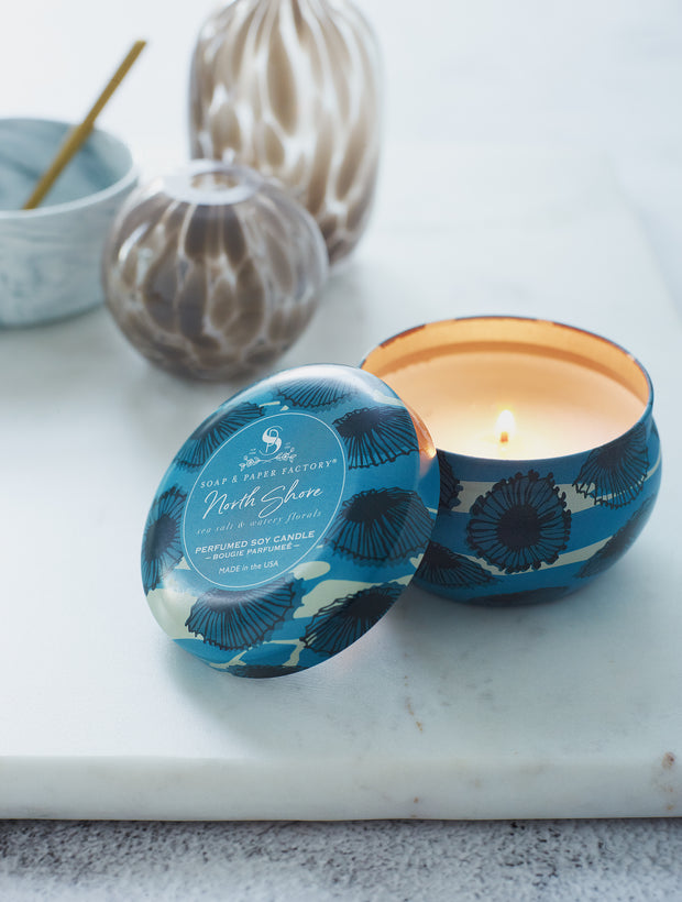 North Shore features deeply layered notes of sea salt & lush, watery florals. This 3 oz tin soy candle burns clean for up to 18 hours. Perfect for travel! 