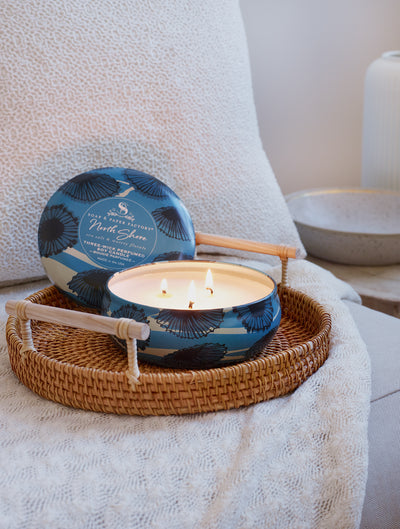 North Shore features deeply layered notes of sea salt & lush, watery florals. This 13 oz three-wick tin soy candle burns clean for up to 32 hours. Perfect for travel! 